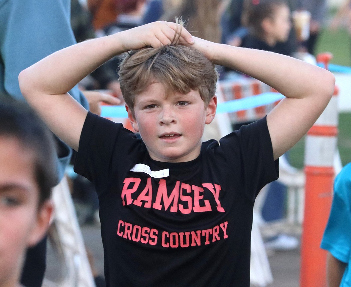Ramsey fourth-grader Levi Waterhouse recovers after his race on Thursday.