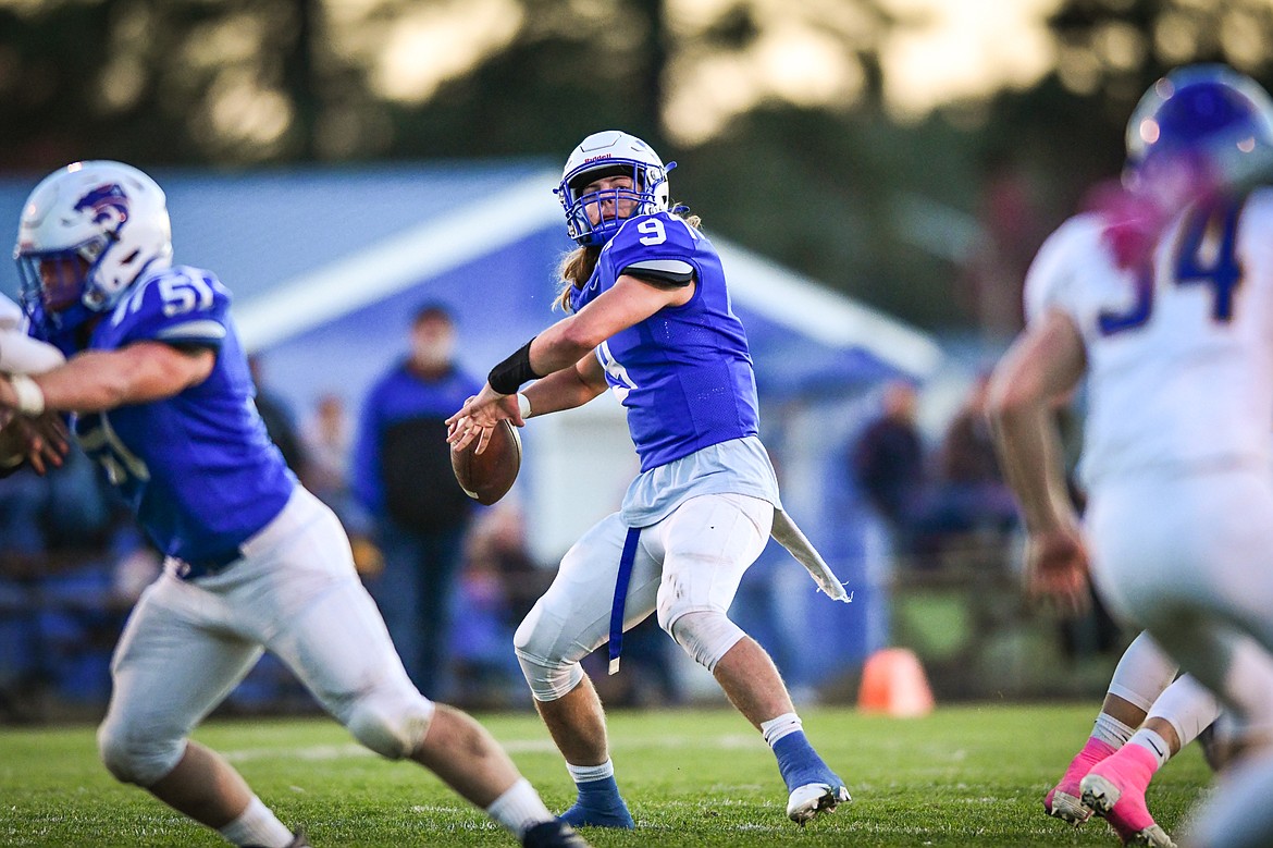 Columbia Falls quarterback Cody Schweikert (9) drops back to pass in the first quarter against Libby at Satterthwaite Field on Friday, Oct. 6. (Casey Kreider/Daily Inter Lake)