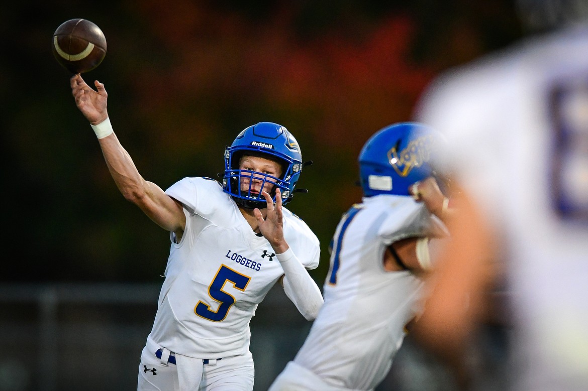 Libby quarterback Tristan Andersen (5) drops back to pass in the first quarter against Columbia Falls at Satterthwaite Field on Friday, Oct. 6. (Casey Kreider/Daily Inter Lake)