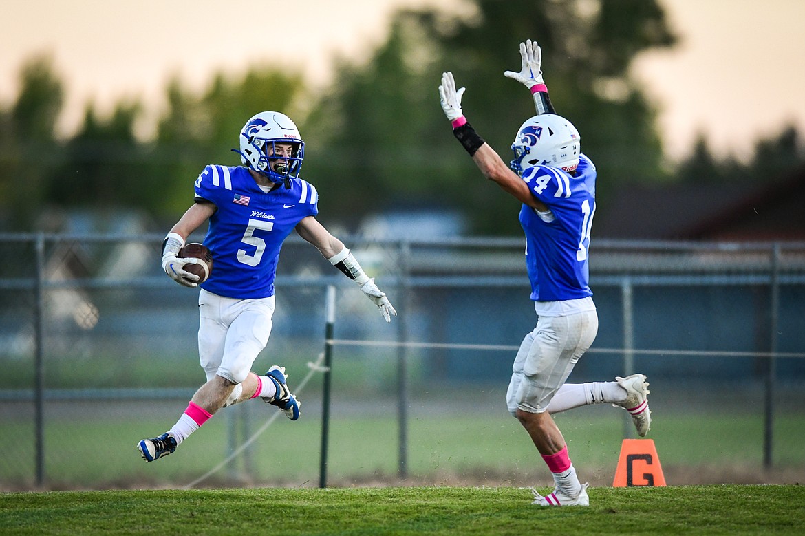 Columbia Falls kick returner Mark Robison (5) celebrates with Jace Hill (14) after returning a punt for a touchdown in the first quarter against Libby at Satterthwaite Field on Friday, Oct. 6. (Casey Kreider/Daily Inter Lake)