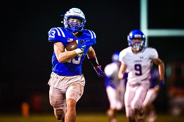 Columbia Falls kick returner Alihn Anderson (13) returns a kickoff for a touchdown in the third quarter against Libby at Satterthwaite Field on Friday, Oct. 6. (Casey Kreider/Daily Inter Lake)