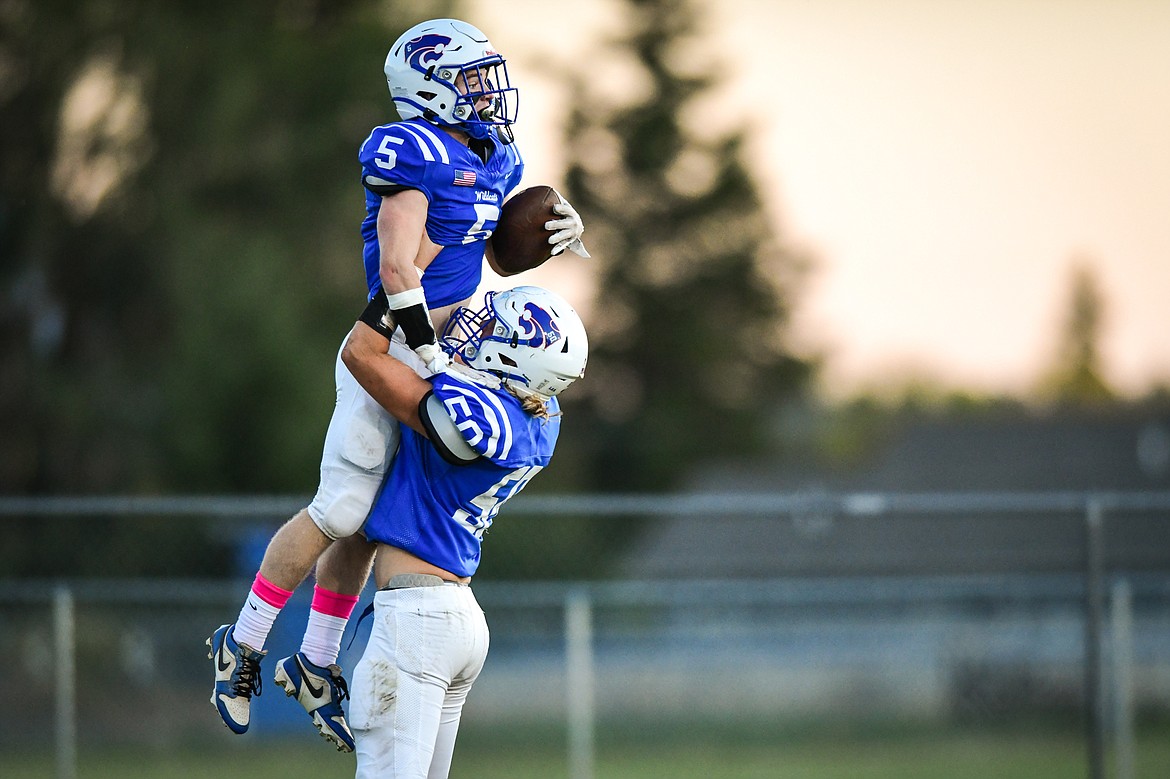 Columbia Falls kick returner Mark Robison (5) celebrates with Hunter Goodman (50) after returning a punt for a touchdown in the first quarter against Libby at Satterthwaite Field on Friday, Oct. 6. (Casey Kreider/Daily Inter Lake)
