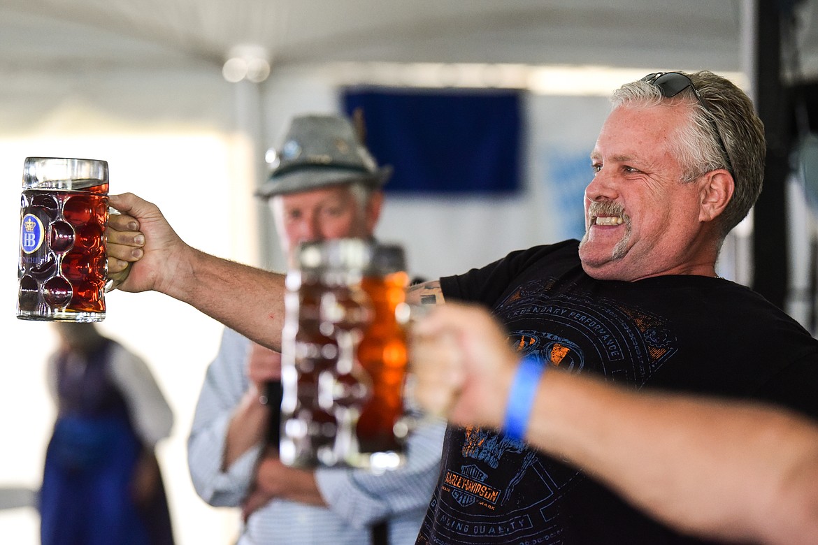 A competitor strains to keep his stein level during the mens' stein-holding contest at The Great Northwest Oktoberfest in Whitefish on Saturday, Oct. 7. (Casey Kreider/Daily Inter Lake)