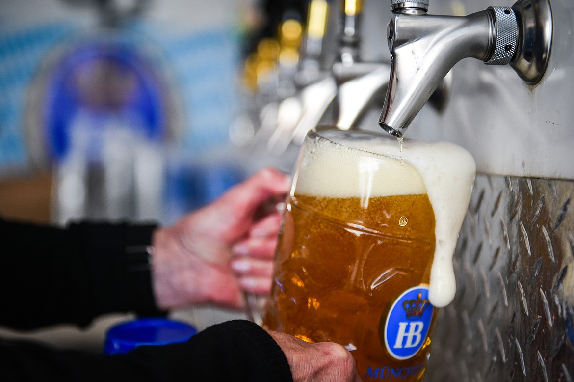 A bartender fills a mug at the biergarten at The Great Northwest Oktoberfest in Whitefish on Saturday, Oct. 7. (Casey Kreider/Daily Inter Lake)