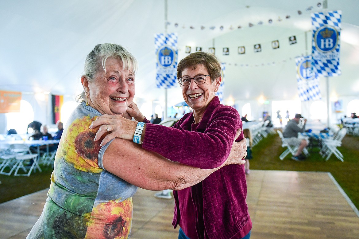 Pam Saunders and Donna Willett, whose family and friends traveled from Seattle to attend, dance to the music of The Bavarian Echoes at The Great Northwest Oktoberfest in Whitefish on Saturday, Oct. 7. (Casey Kreider/Daily Inter Lake)