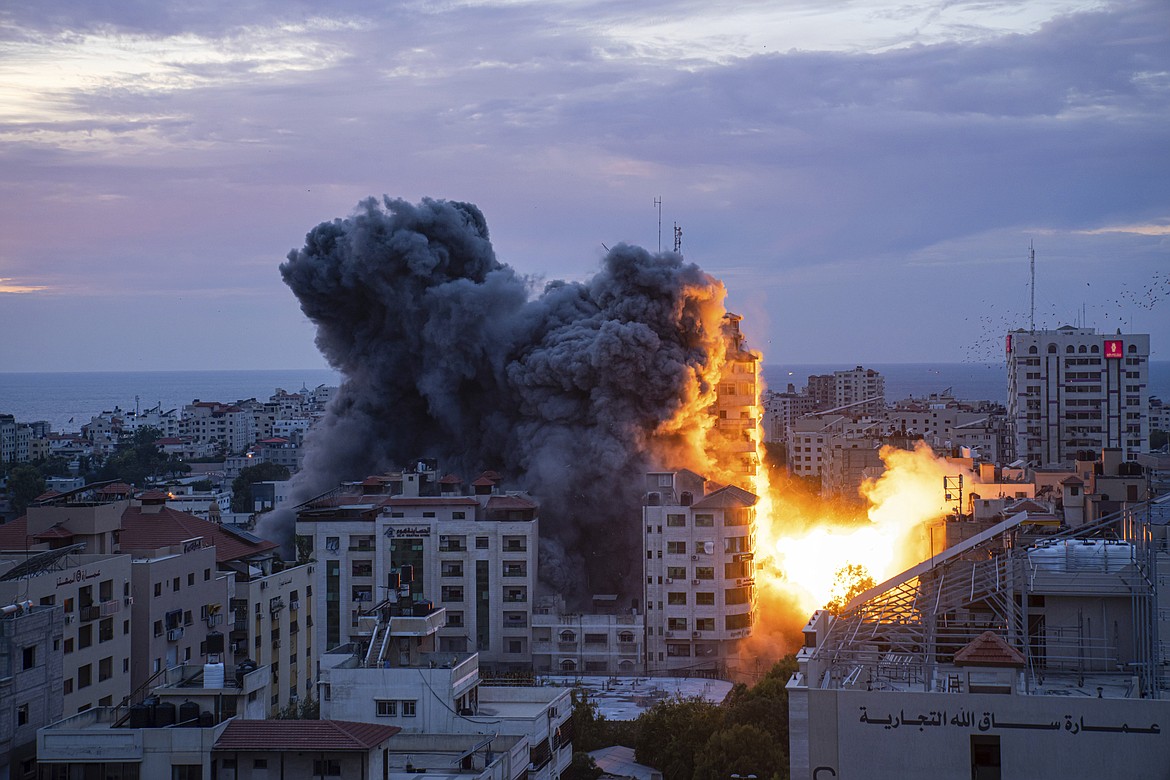 Fire and smoke rise following an Israeli airstrike, in Gaza City, Saturday, Oct. 7, 2023. The militant Hamas rulers of the Gaza Strip carried out an unprecedented, multi-front attack on Israel at daybreak Saturday, firing thousands of rockets as dozens of Hamas fighters infiltrated the heavily fortified border in several locations by air, land, and sea, killing dozens and stunning the country. Palestinian health officials reported scores of deaths from Israeli airstrikes in Gaza. (AP Photo/Fatima Shbair)