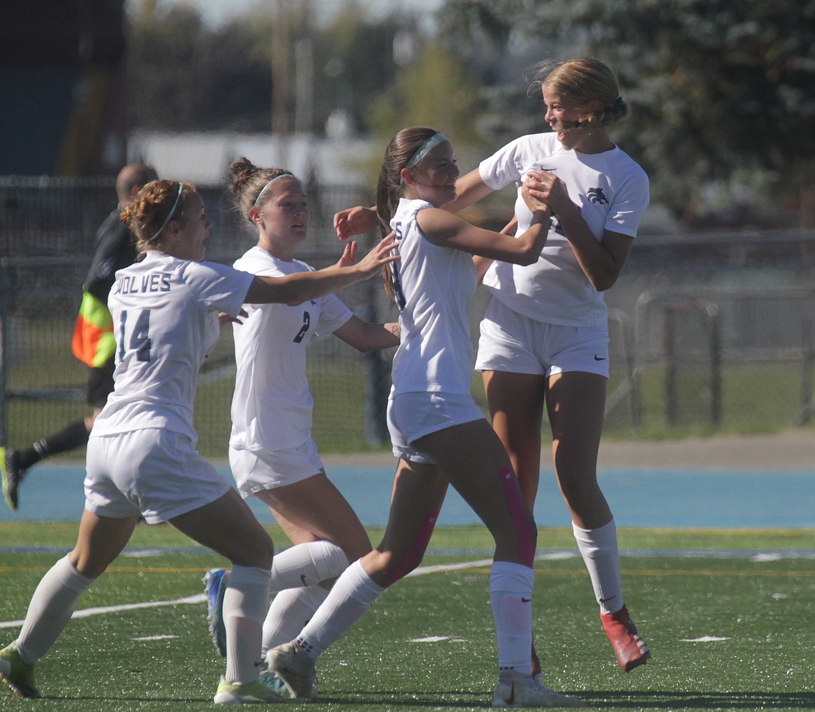 MARK NELKE/Press
Lake City celebrates a goal by freshman Riley Brazle in the first half of Saturday's 5A Region 1 soccer semifinal at Coeur d'Alene. From left: Leah Cysewski, Chloe Burkholder, Brazle and Ella Pearson.