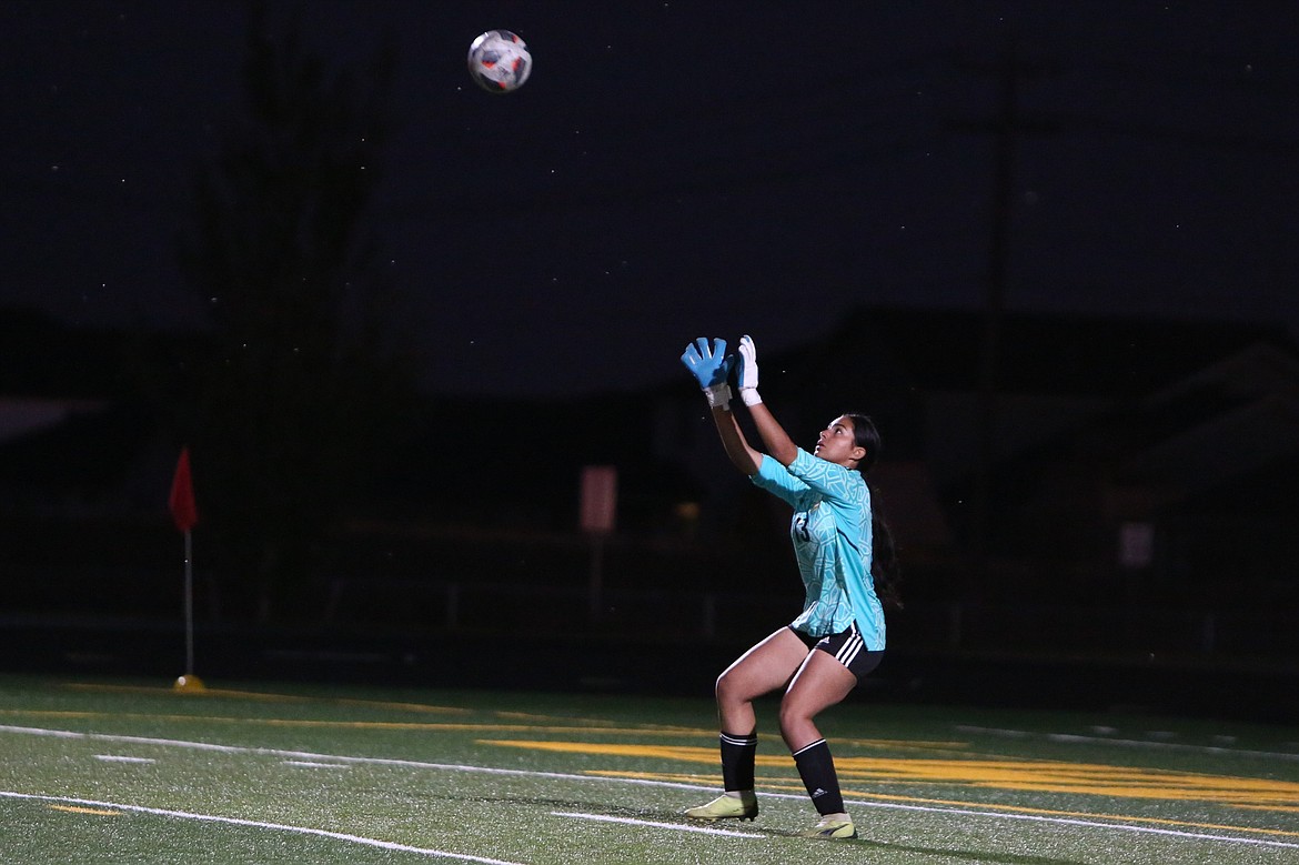 Quincy freshman Aylen Garcia saves a Cashmere shot.