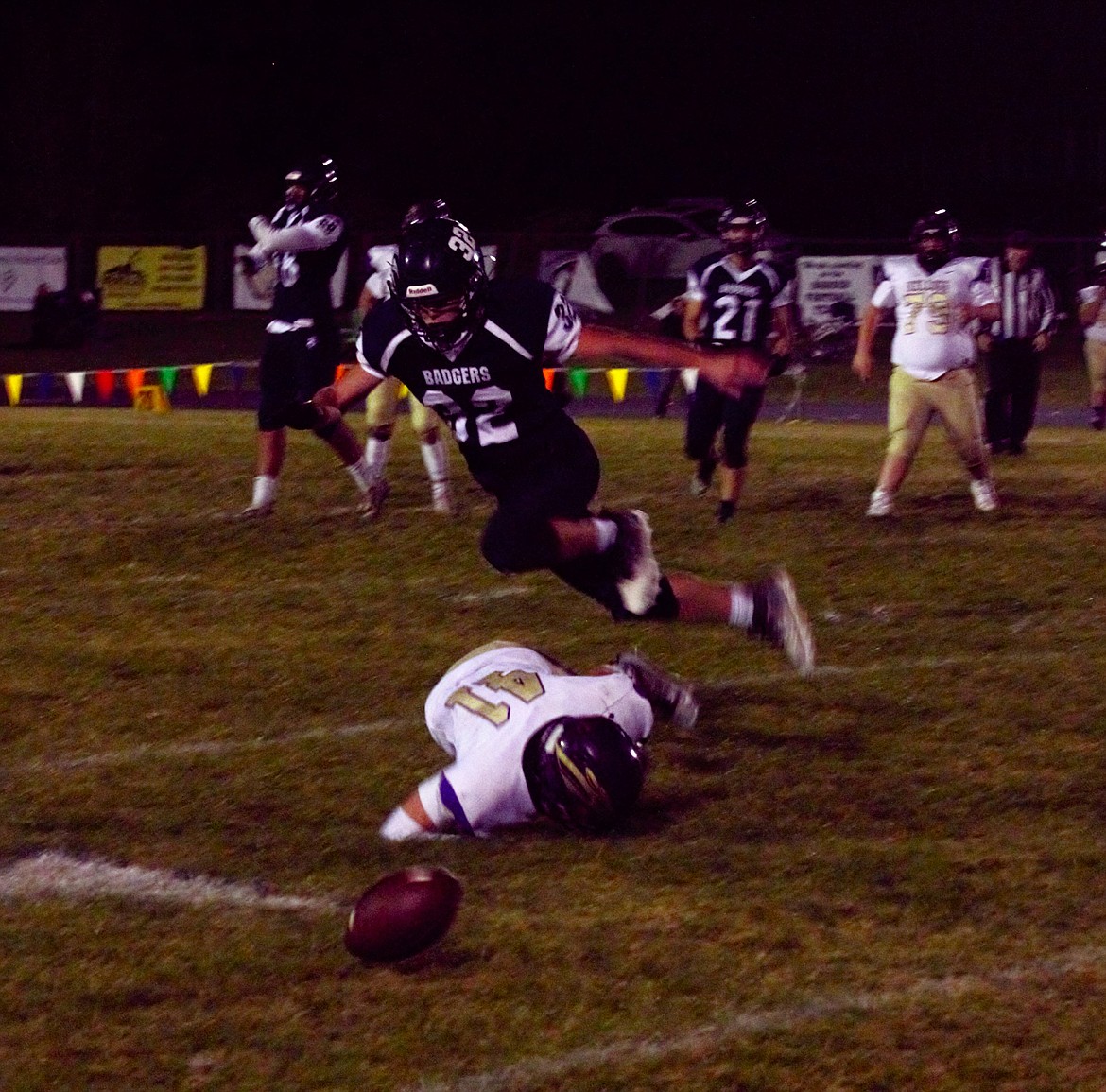 #32 Matthias Gardner plays tough defense for the Badgers against the Kellogg Wildcats.