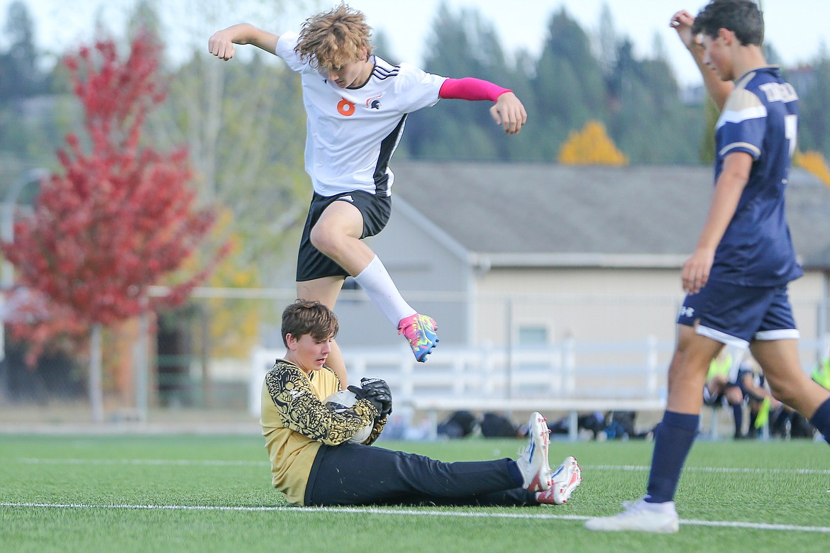 JASON DUCHOW PHOTOGRAPHY
Timberlake junior goalkeeper Zach Blansfield secures the ball as sophomore Henry White (8) of Priest River hurdles him during a first-round game of the 3A District 1-2 boys soccer tournament at The Fields at Real Life in Post Falls.