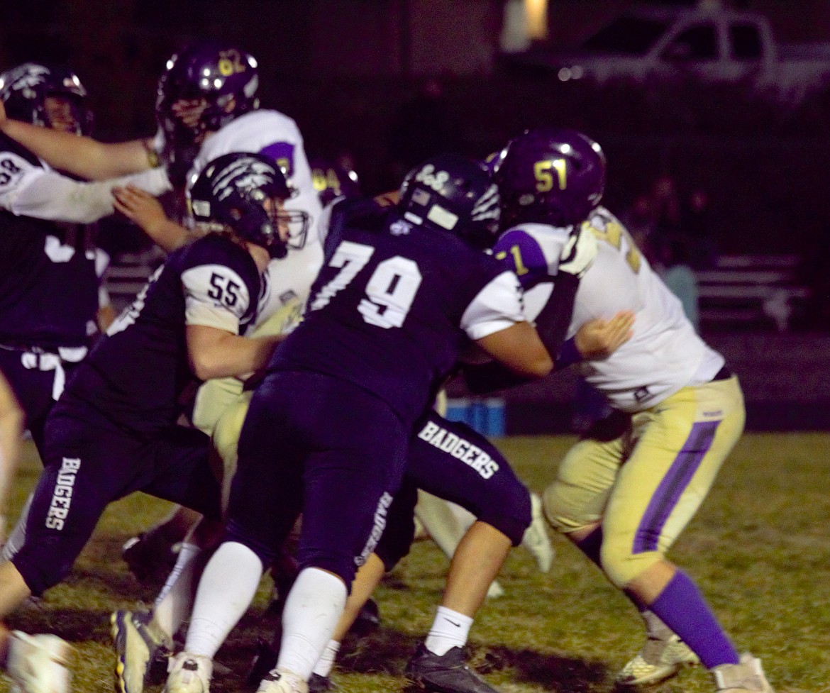 #55 Kolton Rude and #79 Makeen Loretto of the Bonners Ferry defensive line hold back Wildcats.