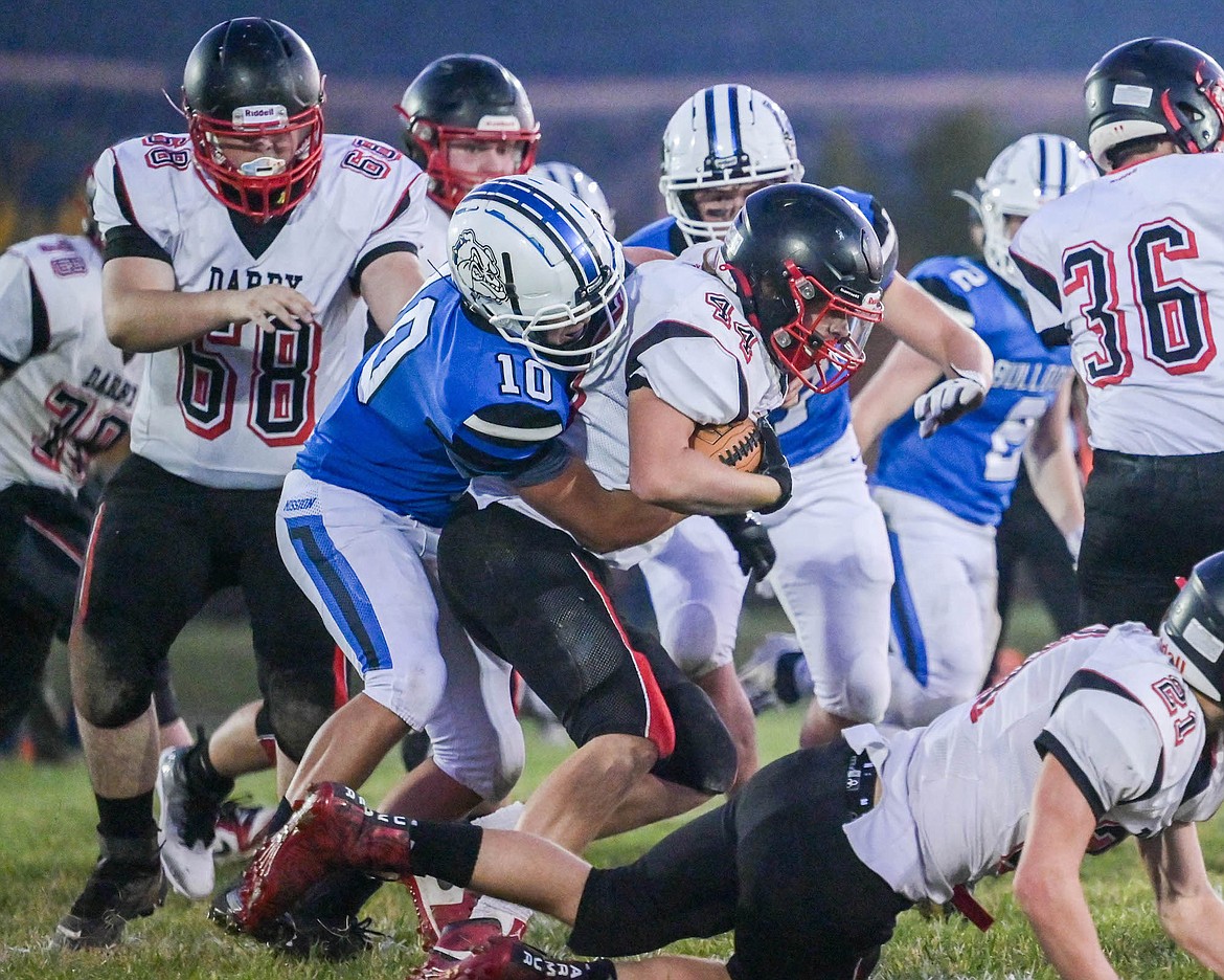 Mission's Sheldon McLeod makes the tackle during Friday's triumphant game agains Victor. (Christa Umphrey photo)