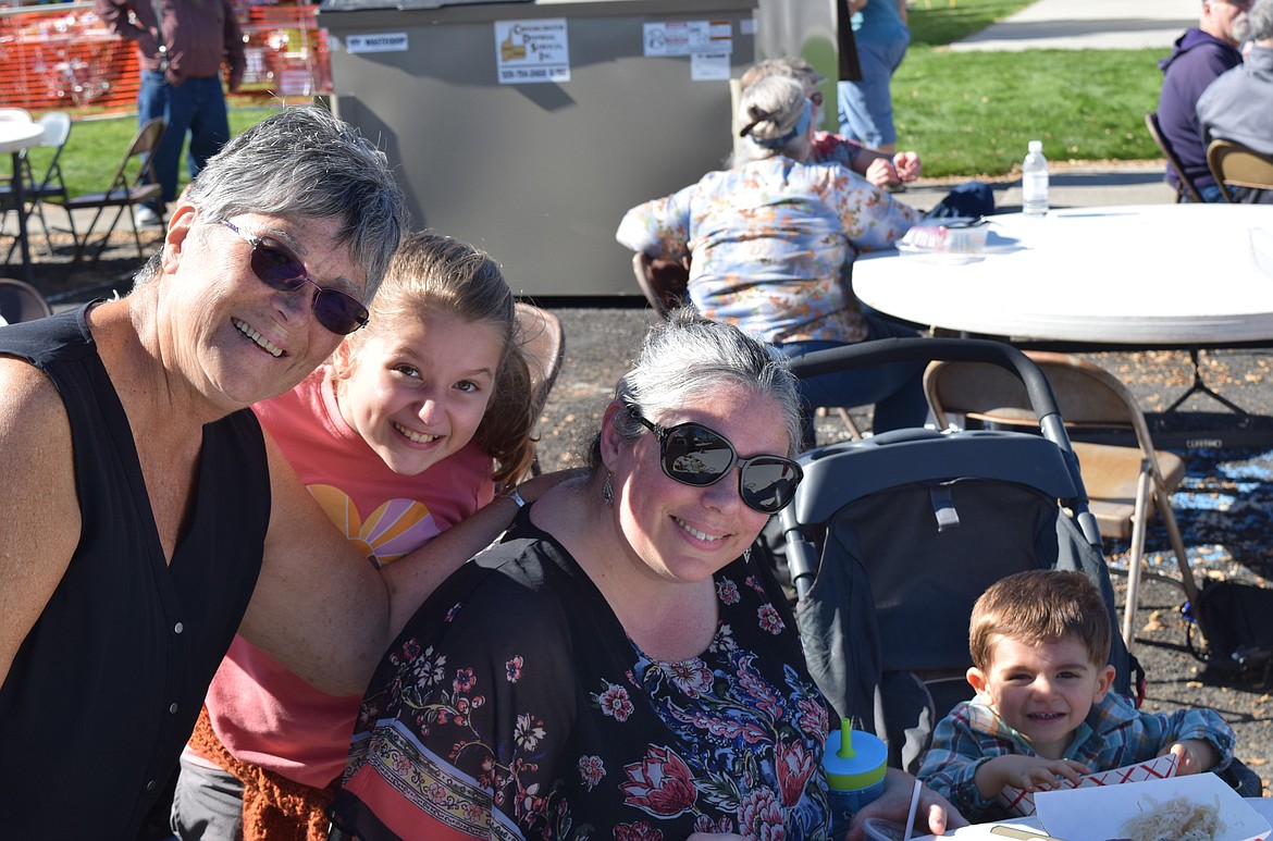 From left to right, Colleen Kagel, her granddaughter Adelyn Garner, Adelyn’s mother Nicole Garner and Nicole’s son. Nicole and her kids came from Bonney Lake to attend the auction with Kagel, a member of Menno Mennonite Church.