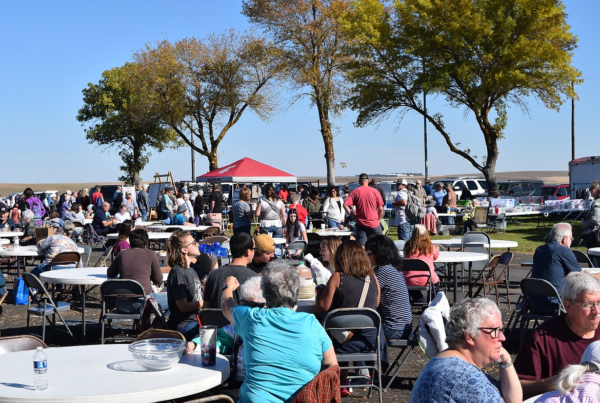 Community members enjoy the various offerings at Saturday’s Mennonite Auction at Menno Mennonite Church.