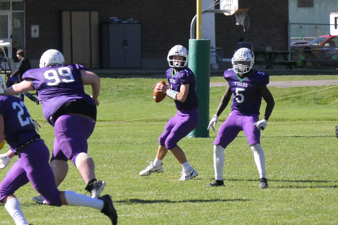 St. Regis-Mullan quarterback Conner Lulis looks for an open receiver during the Tigers' Homecoming game against Shelby Saturday afternoon in St. Regis. (Chuck Bandel/MI-VP)