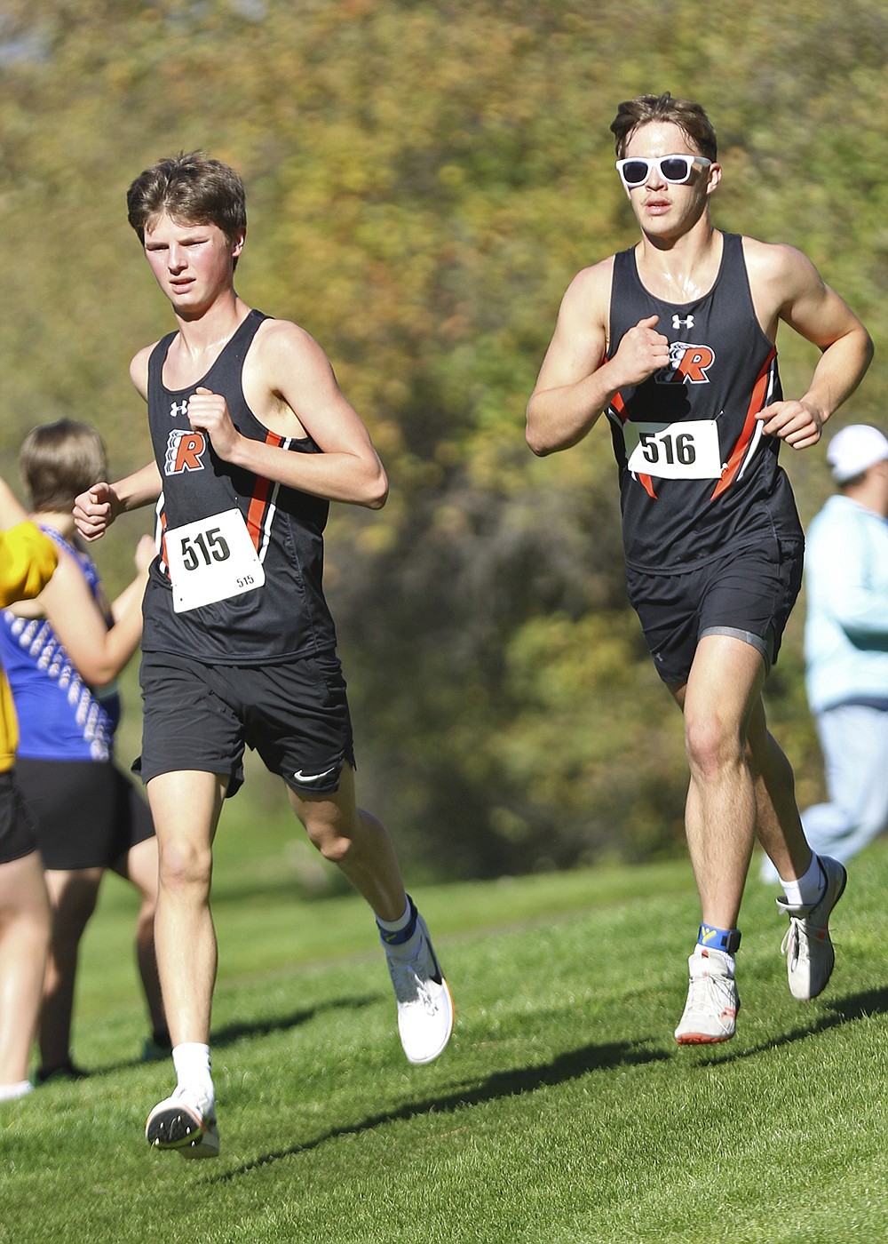 Will Normandeau and Koda King stride along the course of the Mission 
Shadow Duels meet in Pablo. The Ronan boys team took second at Saturday's event. (Bob Gunderson photo)