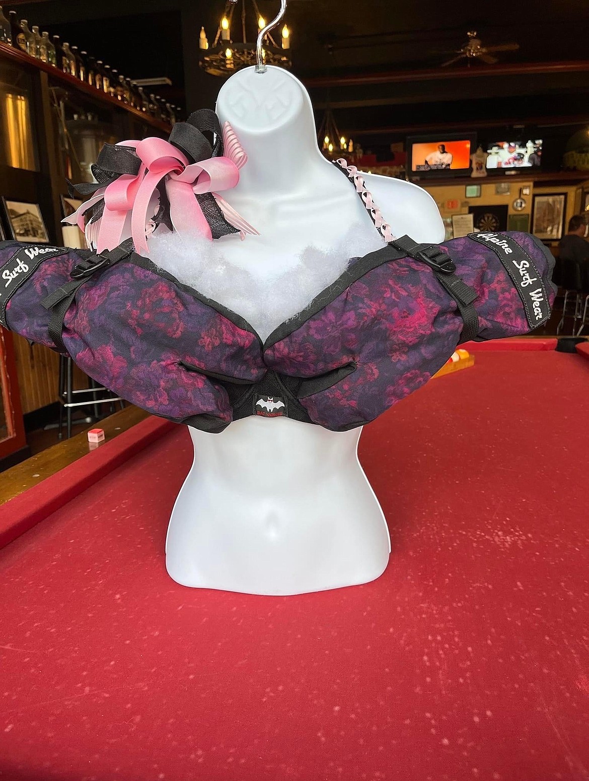 Rae'Lynn Howell turned gloves from Bat Waves into a decorative bra to auction off during the TaTa's Party.