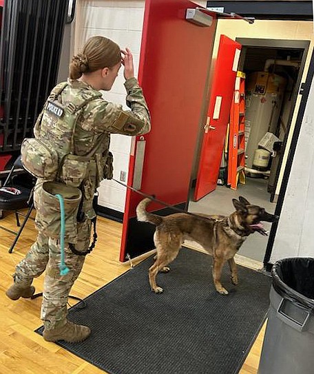 A K-9 officer checks out Lind-Ritzville High School Thursday following a bomb threat received by email. No explosive devices were found.