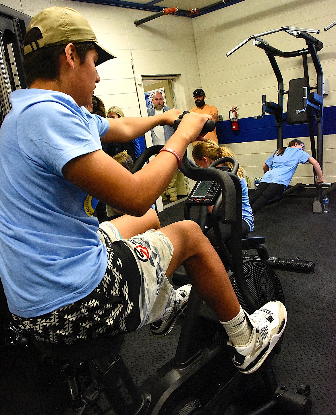 St. Ignatius middle school students work out in their brand new fitness center. Teachers Christy Krantz and Stacey Doll and the middle school students produced a video, and their video won them a $100,000 fitness center from the National Foundation for Governors' Fitness Councils. (Berl Tiskus/Leader)
