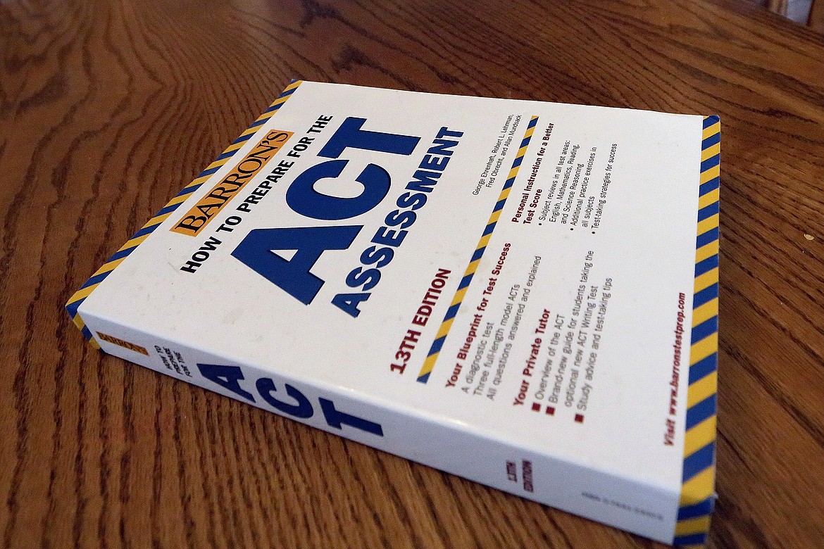 An ACT Assessment preparation book is seen, April 1, 2014, in Springfield, Ill. High school students' scores on the ACT college admissions test for 2023 dropped to their lowest in more than three decades, showing a lack of student preparedness for college-level coursework, the nonprofit organization that administers the test said Wednesday, Oct. 11, 2023. (AP Photo/Seth Perlman, File)