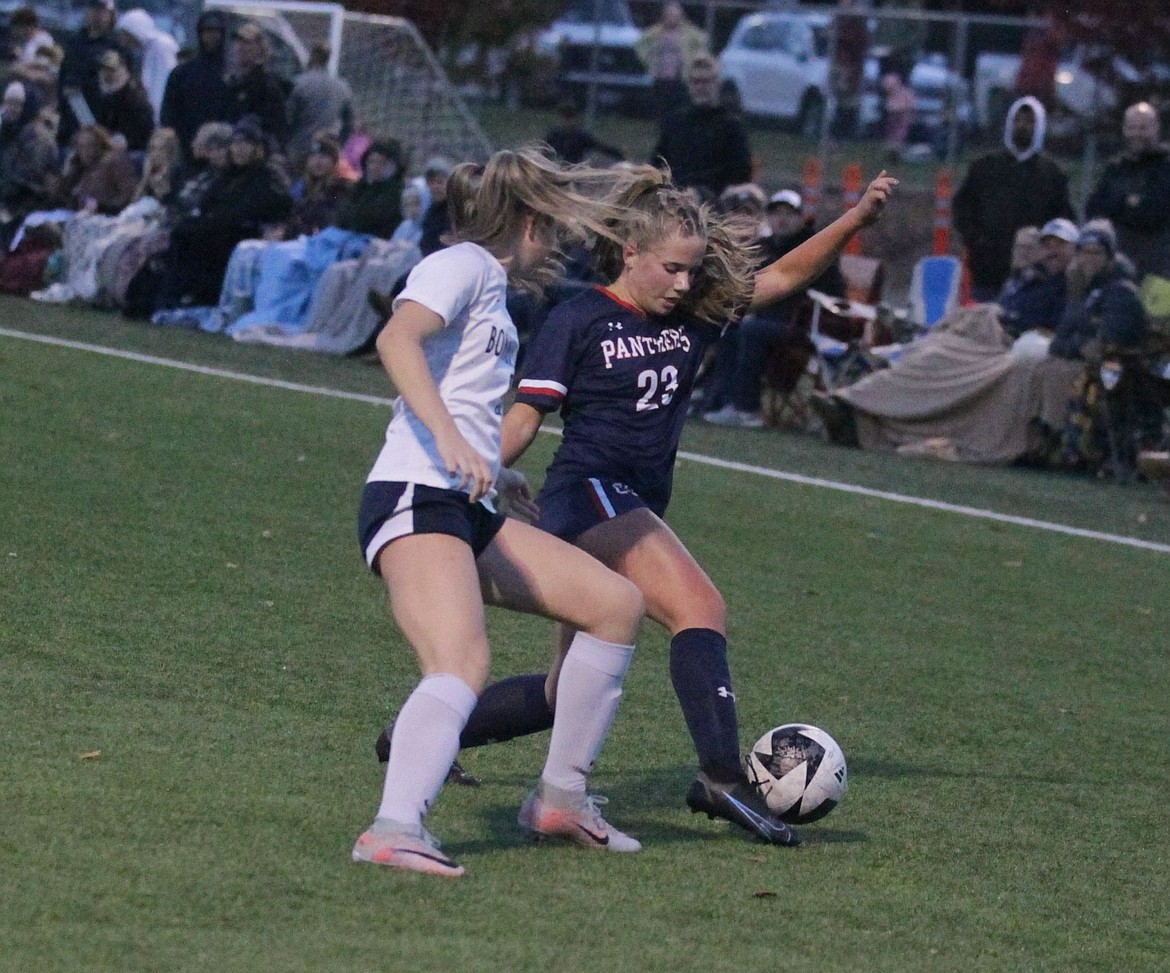 JASON ELLIOTT/Press
Coeur d'Alene Charter senior forward Emma Fisch attempts to keep the ball away from a Bonners Ferry defender during the first half of Wednesday's 3A District 1-2 girls soccer championship match at The Fields at Real Life Ministries.