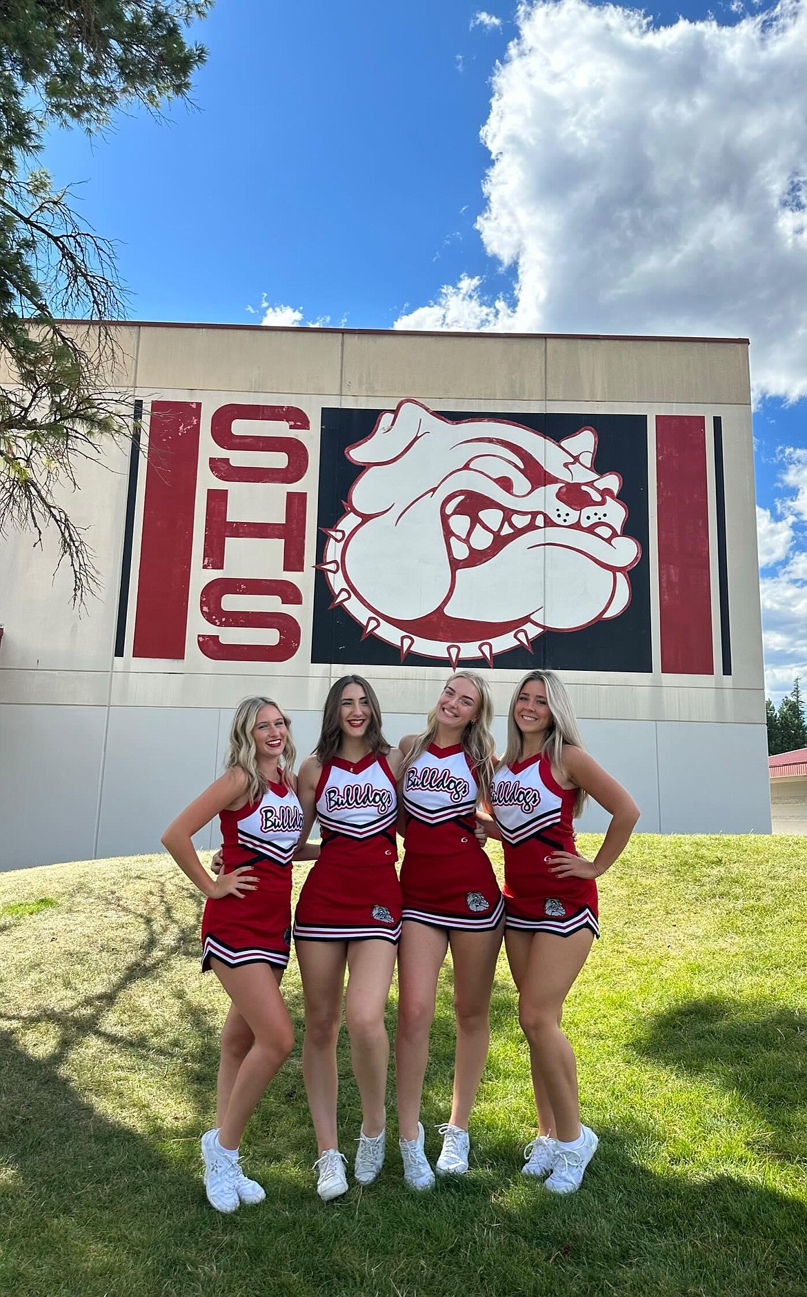 Sandpoint cheer team seniors pose for a photo outside of Sandpoint high school. From left to right, Taylor Granier, Shaina Crabb, Annie Gove, and Mia Przybylski.