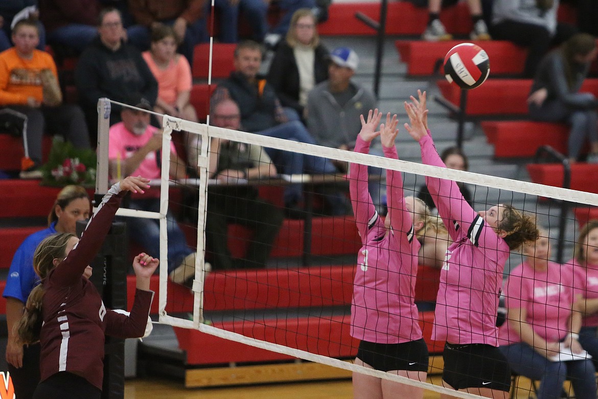 Lind-Ritzville/Sprague junior Addy Colbert (3) and sophomore Saige Galbreath (12) go up for a block during the Broncos’ sweep of Reardan on Tuesday.