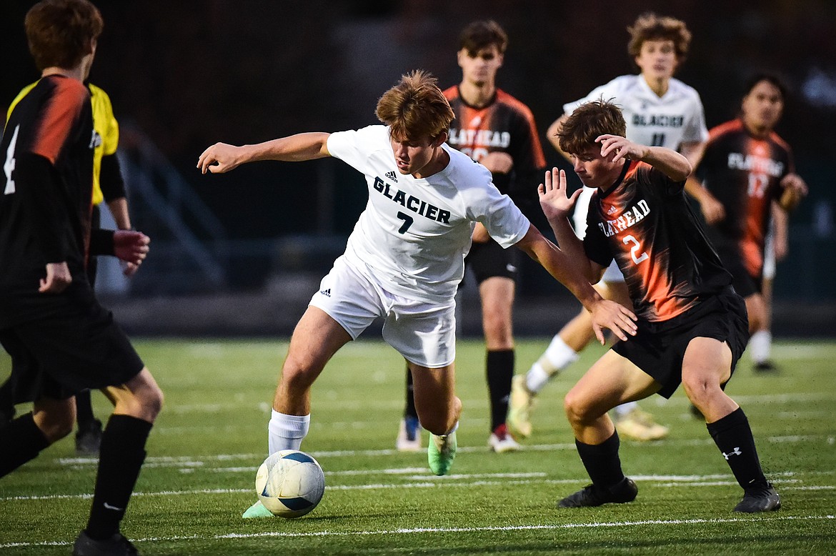 Glacier's Joey Paolini (7) pushes the ball upfield in the second half against Flathead at Legends Stadium on Thursday, Oct. 12. (Casey Kreider/Daily Inter Lake)