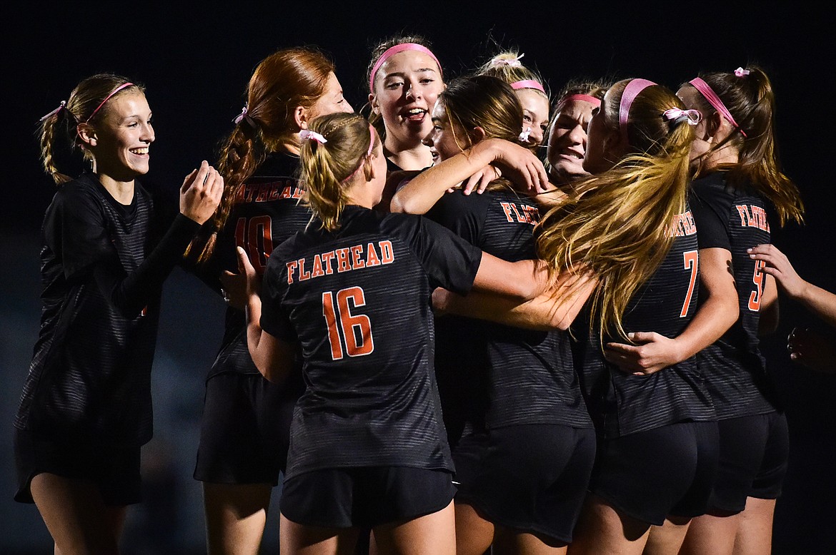 The Bravettes celebrate after Avi Schmautz's (14, center) goal in the first half against Glacier at Legends Stadium on Thursday, Oct. 12. (Casey Kreider/Daily Inter Lake)