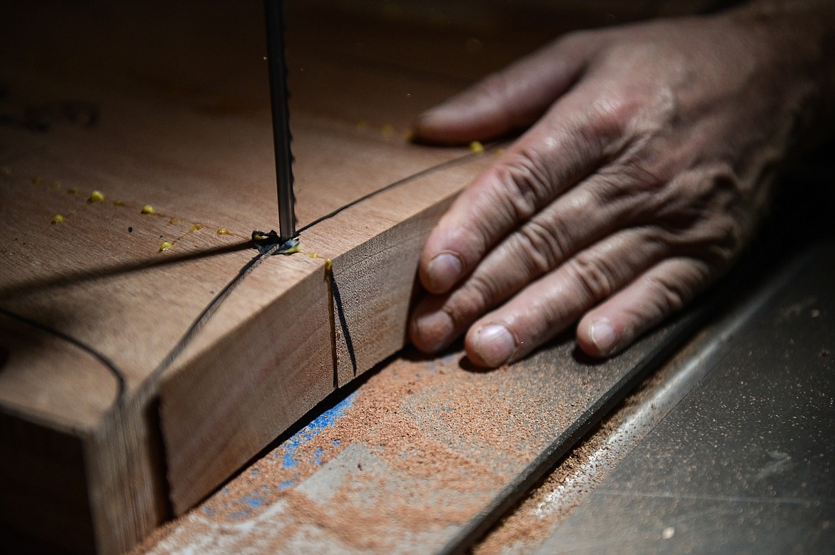 Steve Henneford cuts a profile for one of his dining chairs at Henneford Fine Furniture on Tuesday, Oct. 10. (Casey Kreider/Daily Inter Lake)