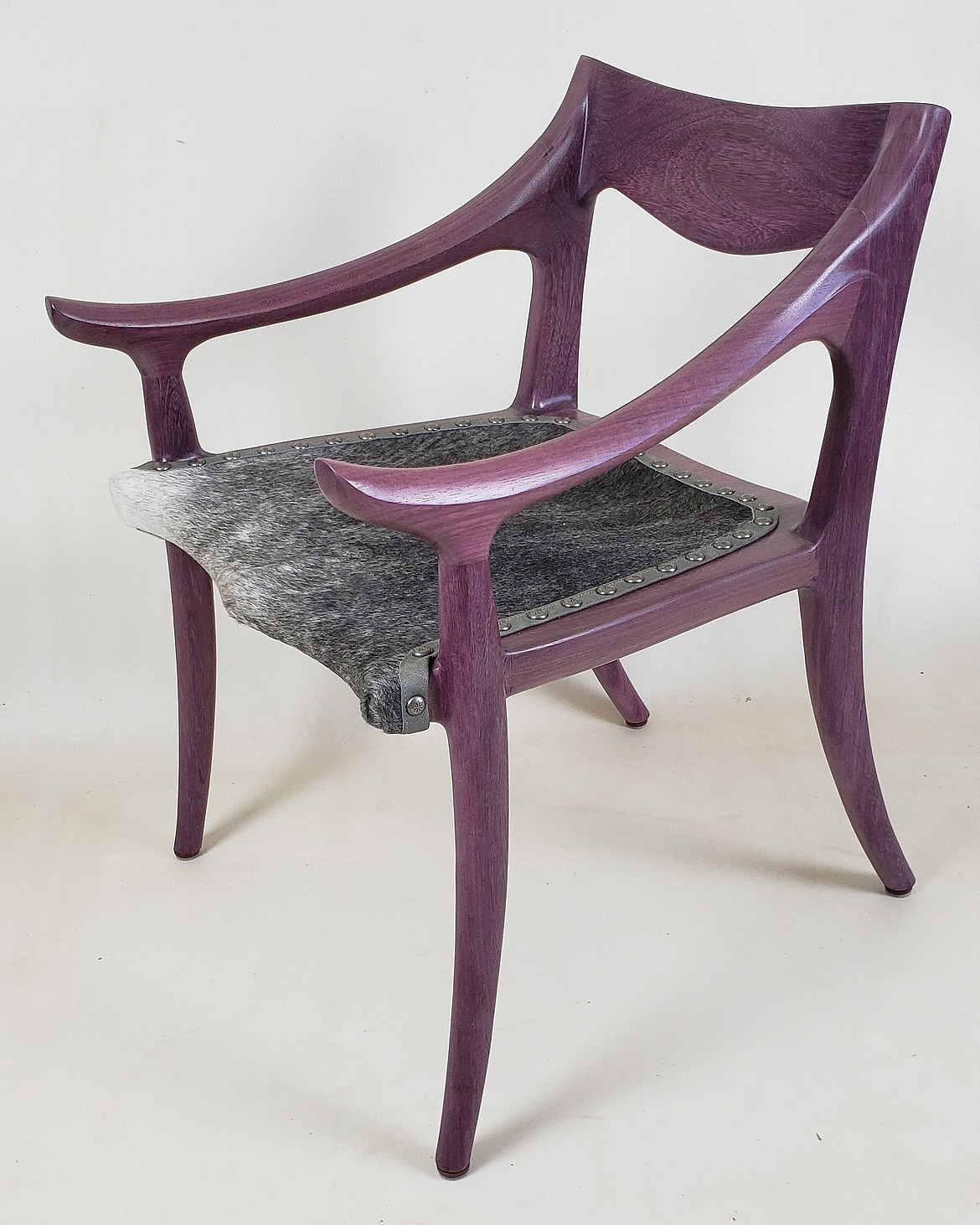 A purpleheart with cow hair on hide low-back chair made by Steve Henneford of Henneford Fine Furniture (Steve Henneford photo)