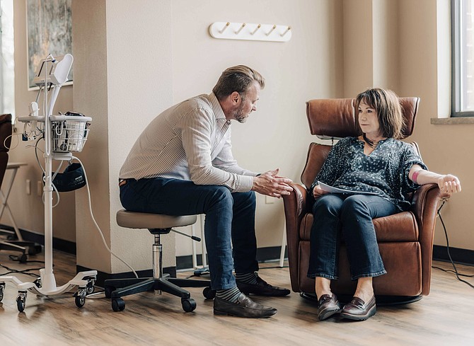 A Beacon Clinic physician meets with a patient.