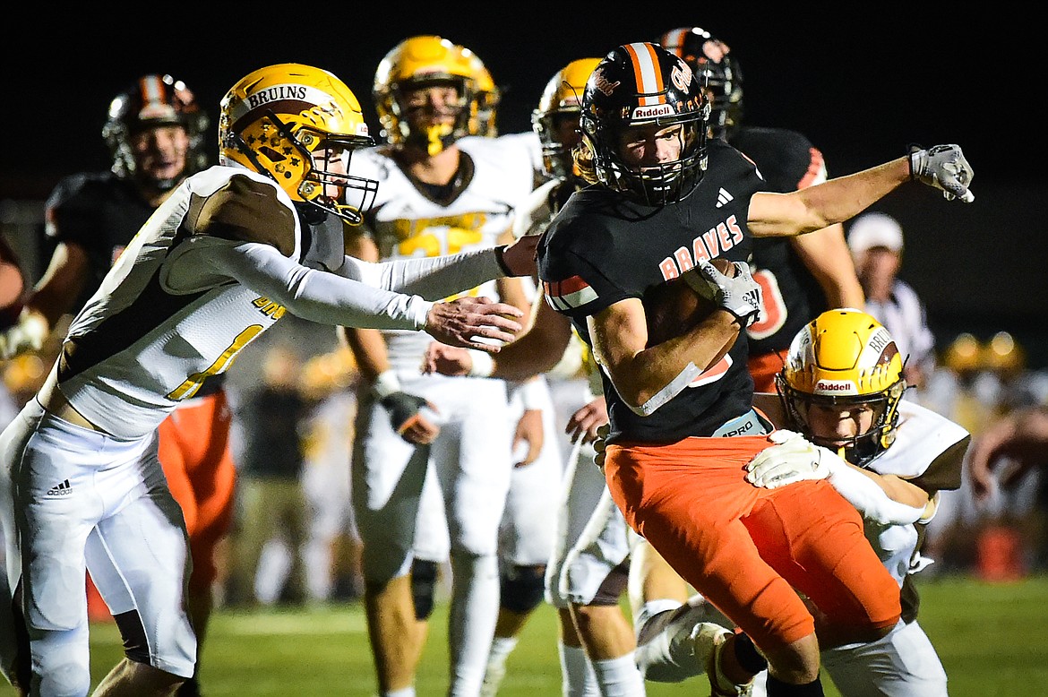 Flathead wide receiver Ben Bliven (2) picks up yardage on a run in the fourth quarter against Helena Capital at Legends Stadium on Friday, Oct. 13. (Casey Kreider/Daily Inter Lake)