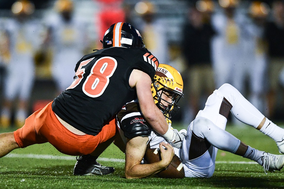 Flathead linebacker Easton Capser (58) sacks Helena Capital quarterback Merek Mihelish (8) in the first quarter at Legends Stadium on Friday, Oct. 13. (Casey Kreider/Daily Inter Lake)