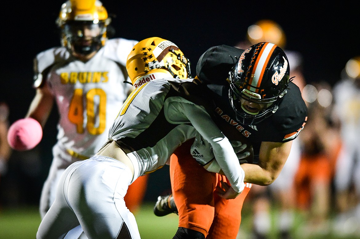 Flathead tight end Gabe Sims (84) is tackled by Helena Capital defensive back Ryan Martinie (11) after a reception in the fourth quarter at Legends Stadium on Friday, Oct. 13. (Casey Kreider/Daily Inter Lake)