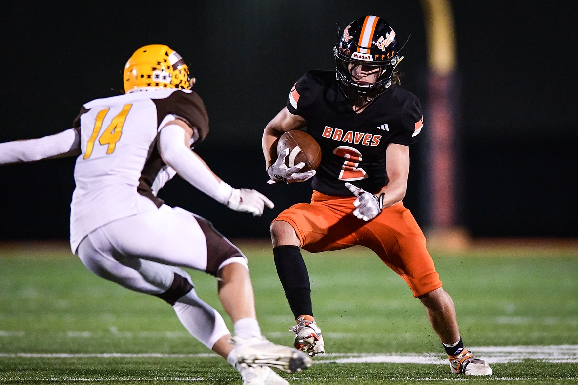 Flathead wide receiver Ben Bliven (2) picks up yardage on a run in the fourth quarter against Helena Capital at Legends Stadium on Friday, Oct. 13. (Casey Kreider/Daily Inter Lake)