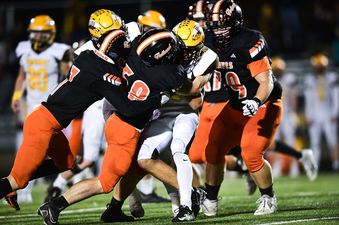 Flathead linebacker Easton Capser (58) puts a stop to a run by Helena Capital running back Cole Graham (25) in the third quarter at Legends Stadium on Friday, Oct. 13. (Casey Kreider/Daily Inter Lake)