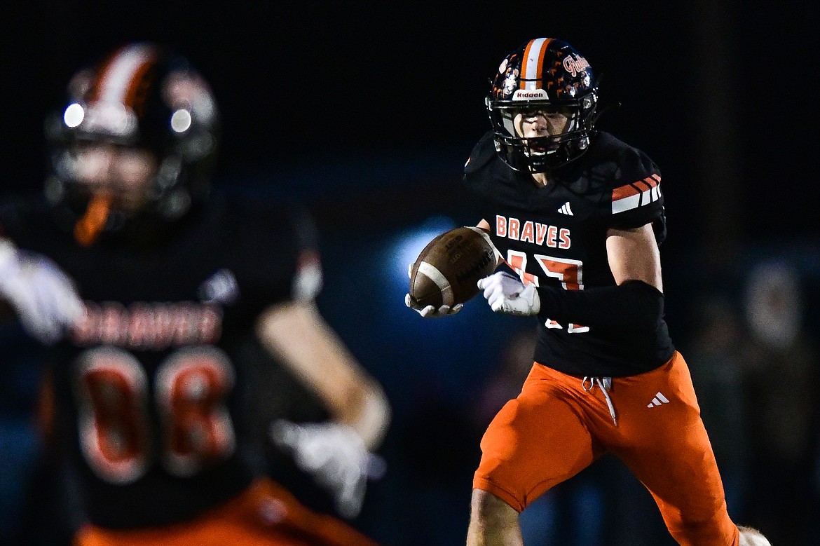 Flathead tight end Braden Capser (47) picks up yardage on a run in the first quarter against Helena Capital at Legends Stadium on Friday, Oct. 13. (Casey Kreider/Daily Inter Lake)