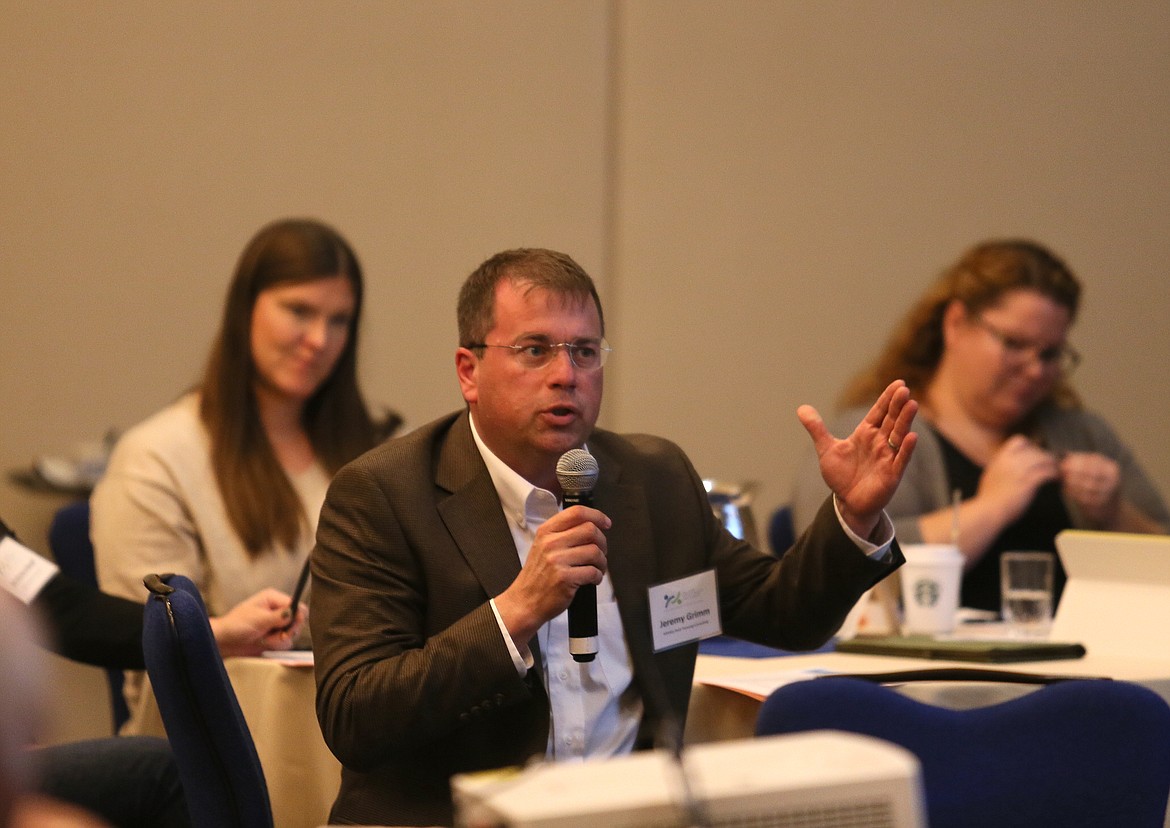 Jeremy Grimm, owner of Whiskey Rock Planning + Consulting in Sandpoint, asks a question Thursday during the Economic Forecast Fall Meeting at The Coeur d'Alene Resort.