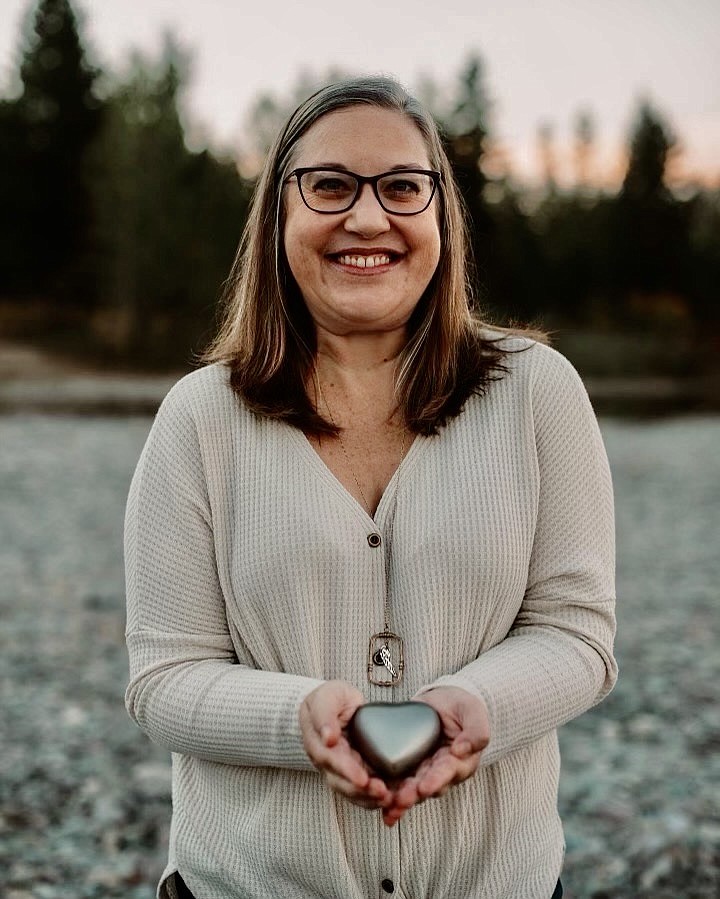 Jessica Fulford holds the ashes of her son Jaron who died shortly after birth. She has used her own grief to assist other families while serving as a bereavement doula. (Courtesy photo)