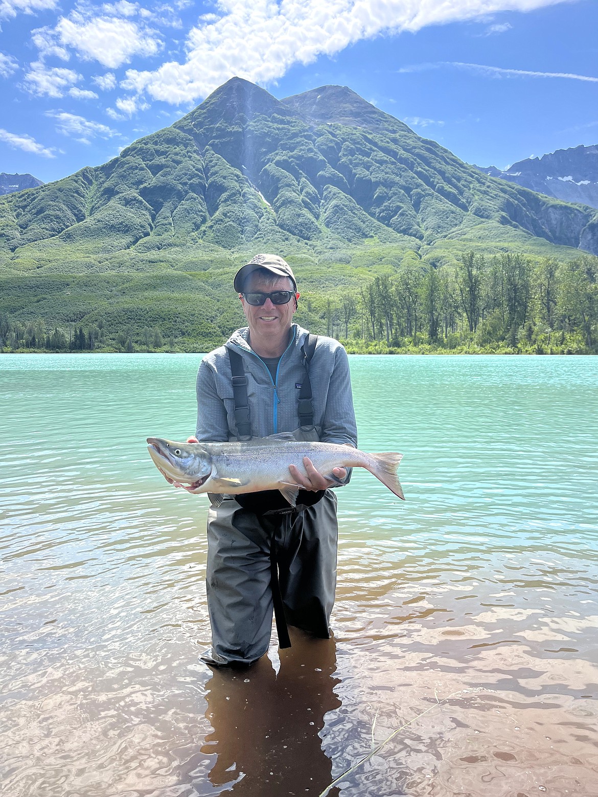 Bill Reagan shows of another fine catch during a fishing trip.