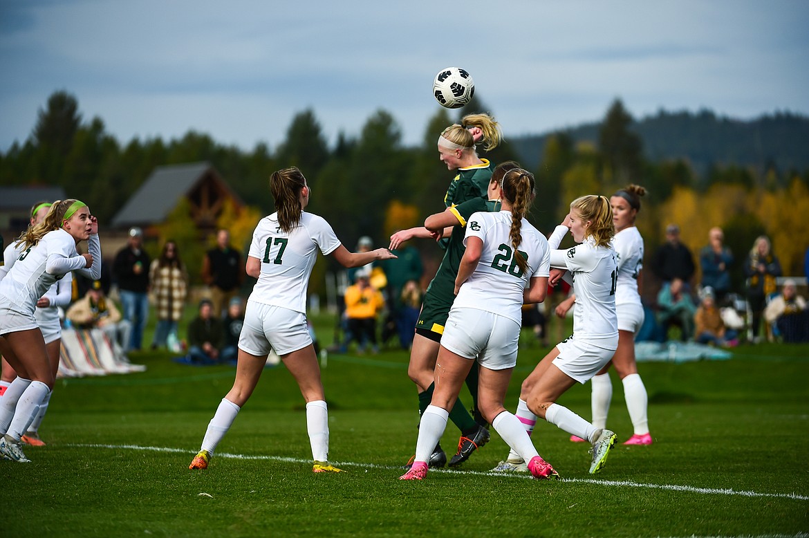 Whitefish's Isabelle Cooke (20) heads a ball off a corner kick in the second half against Billings Central at Smith Fields on Saturday, Oct. 14. (Casey Kreider/Daily Inter Lake)