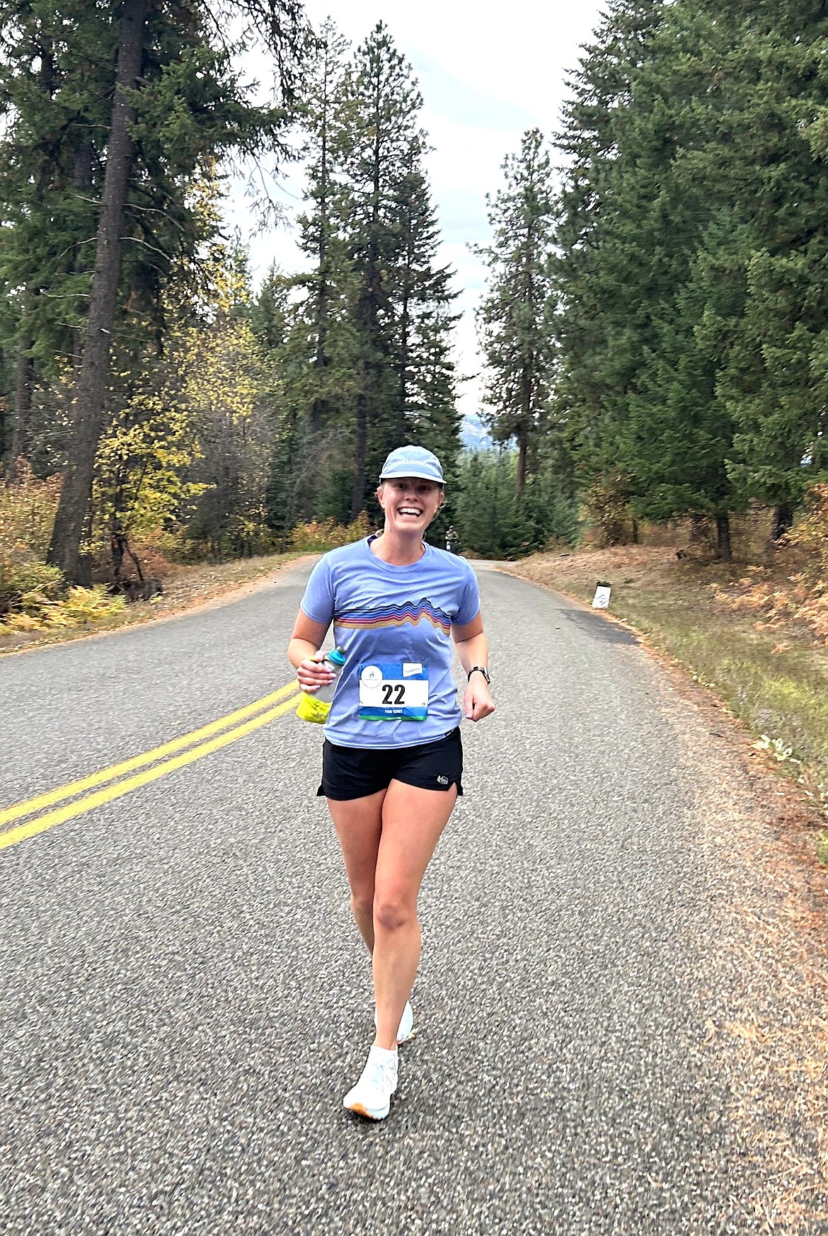 Hayley Smith is still smiling close to the midway point of the Hayden Lake Marathon on Saturday.