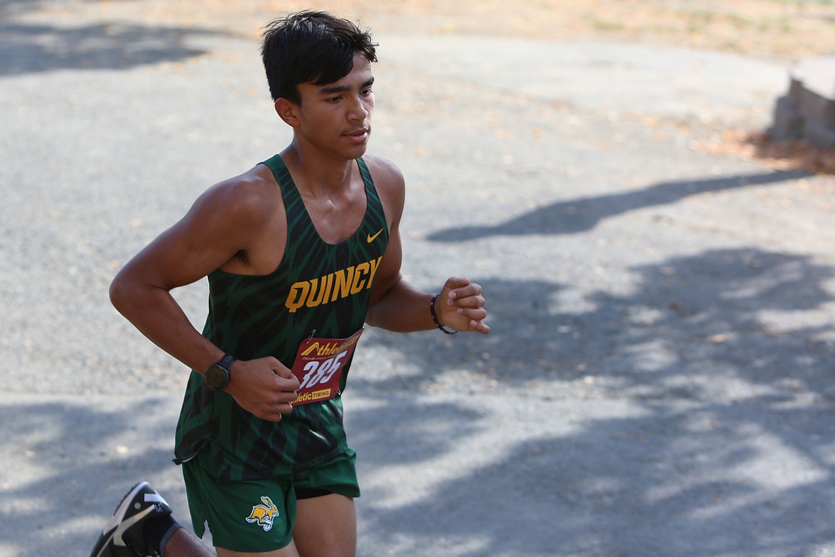 Quincy sophomore Alejandro Birrueta runs ahead at Thursday’s Moses Lake Cross Country Invitational at The Gorge Amphitheater.