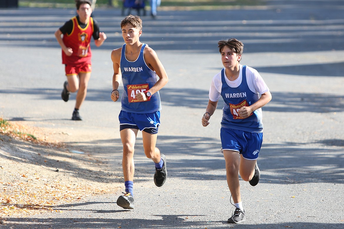 A pair of Warden runners dash along at the Moses Lake Cross Country Invitational at The Gorge Amphitheater.