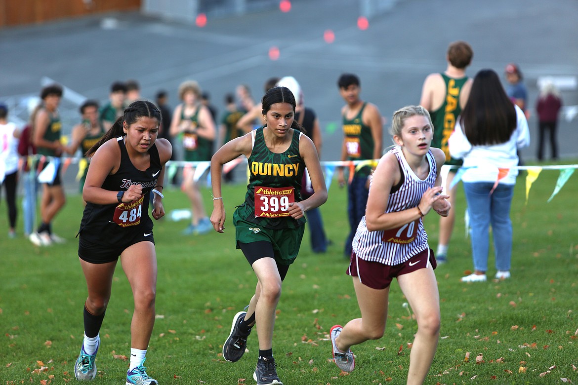 Quincy junior Brenda Uribe (399) runs uphill during the final climb at Thursday’s race at The Gorge Amphitheater.