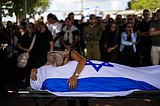 The Israeli public finds itself in grief and shock, but many pledge allegiance to war effort