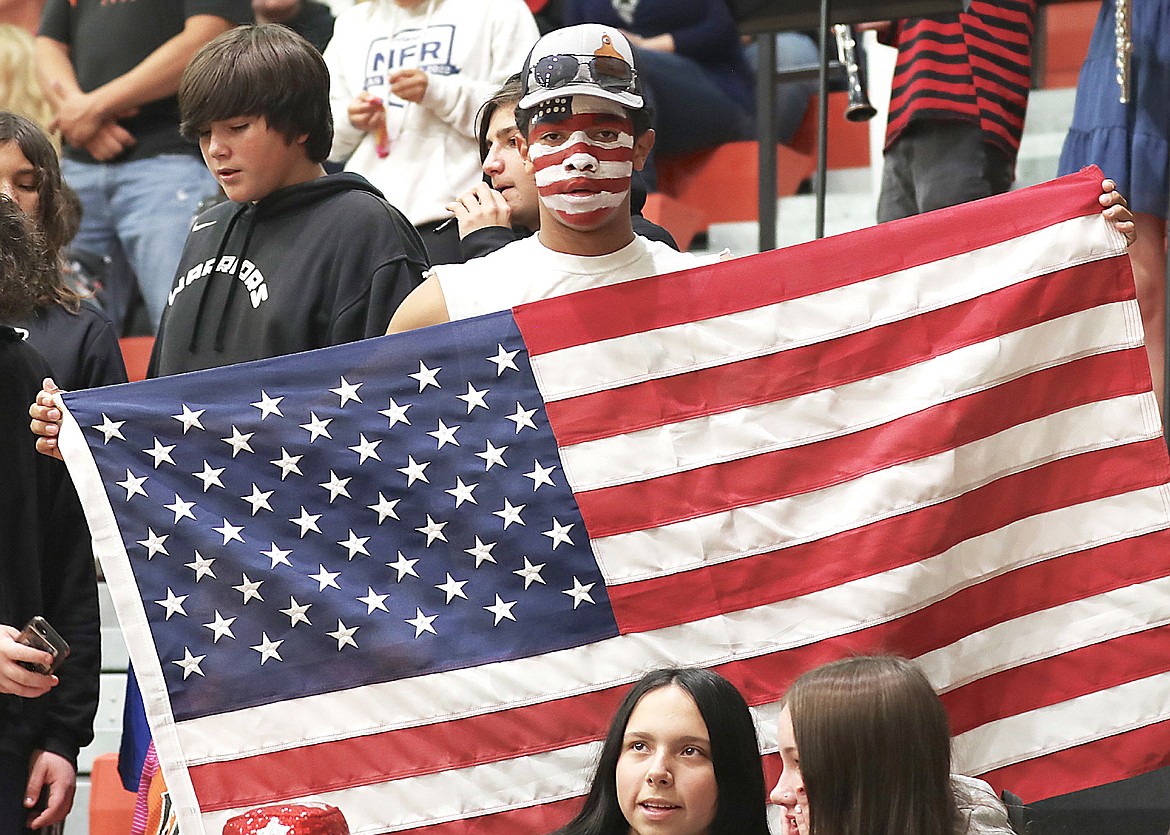 Drew Holmlund shows his patriotic support for the Ronan Maidens during Red, White and Blue Volleyball Night. (Susan Lake photo)