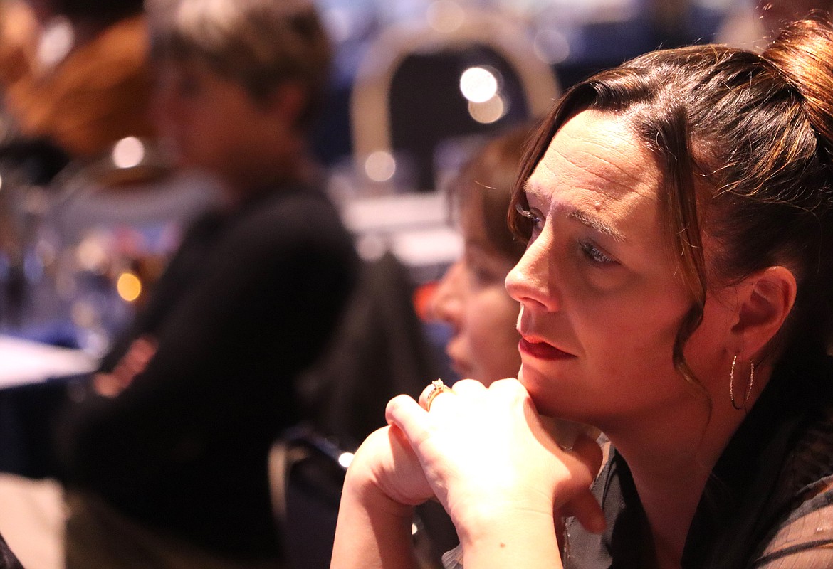 Meg Leech listens to a speaker during "Idaho Listens" at the Hagadone Event Center on Monday night.