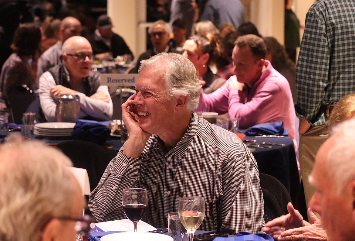 Woody Gavin engages in conversation at "Idaho Listens" at the Hagadone Event Center on Monday night.